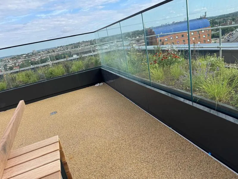Terrace upstand with frameless glass balustrade on a level 10 roof terrace